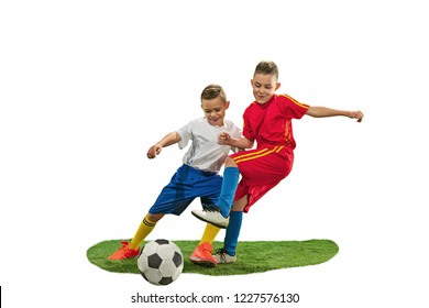 Young Boys With Soccer Ball Doing Flying Kick, Isolated On White. Football Soccer Players In Motion On Studio Background. Fit Jumping Boys In Action, Jump, Movement At Game.