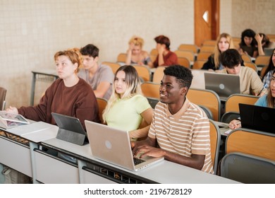 Young Boys In University Class With New Technologies In The Front Row Of The Classroom