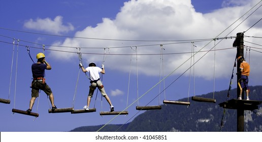 young boys who climb on tree bridge - Powered by Shutterstock