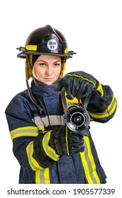 Young Brave Woman In Uniform, Hardhat Of Firefighter Opens Valve On Fire Hose Nozzle For Use And Looking At Camera Isolated On White Background