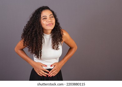 Young Brazilian Black Woman, With Cramps, Abdominal Pain.