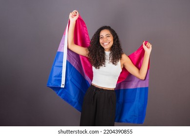 Young Brazilian Black Woman Raising Bisexual Flag, Bisexual Woman, LGBT, LGBTQ