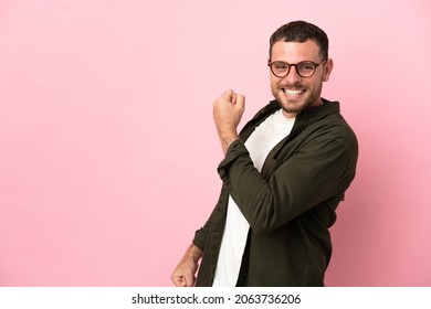 Young Brazilian man isolated on pink background celebrating a victory - Shutterstock ID 2063736206