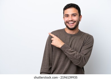 Young Brazilian Man Isolated On White Background Surprised And Pointing Side