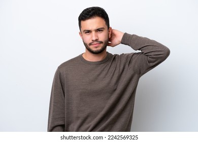 Young Brazilian man isolated on white background having doubts - Powered by Shutterstock