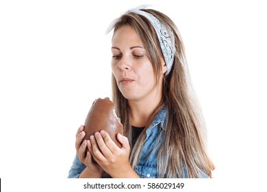 Young Brazilian Woman Eating Chocolate Easter Egg