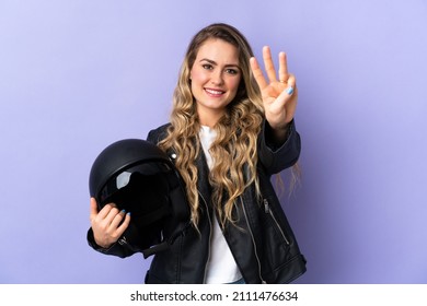 Young Brazilian Woman Holding A Motorcycle Helmet Isolated On Purple Background Happy And Counting Three With Fingers