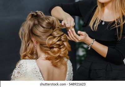 Young Bride Getting Her Hair Done Before Wedding By Professional Hair Stylist