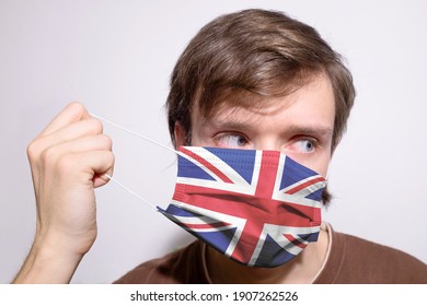 Young British Man Wearing UK United Kingdom Face Mask During Coronavirus Pandemic