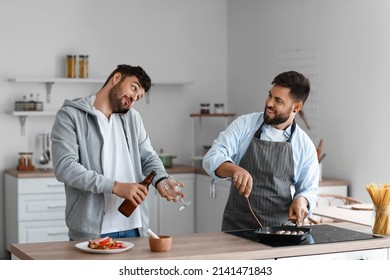 Young Brothers Spending Time Together In Kitchen