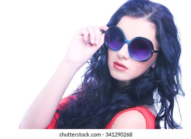 Young brunette with big sunglasses.