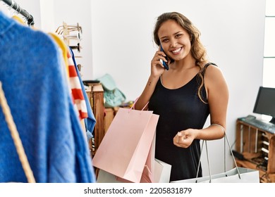 Young Brunette Girl Buying Clothes In The Shop 