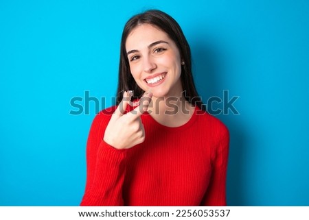 Similar – Image, Stock Photo Woman with a red coat behind a white column, heavily overexposed.