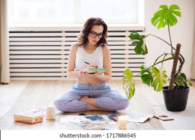 Young Brunette Woman Creating Her Feng Shui Wish Map. Dreams And Wishes