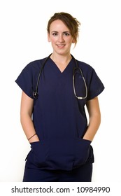 Young Brunette Woman Doctor Wearing Dark Blue Scrubs Uniform With Hands In Pockets Smiling Standing On White Background