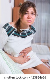 Young Brunette Woman With Early Term Pregnancy Having Miscarriage
