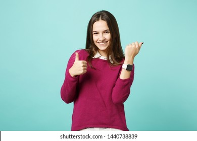 Young brunette woman girl in casual clothes posing isolated on blue green turquoise wall background studio portrait. People sincere emotions lifestyle concept. Mock up copy space. smart watch on hand - Powered by Shutterstock