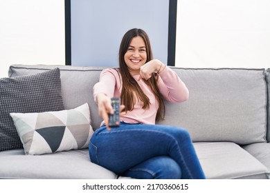 Young Brunette Woman Holding Television Remote Stock Photo 2170360615 ...