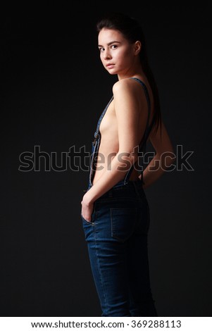 Half naked girl in overalls speaking Curious half naked girl in overalls