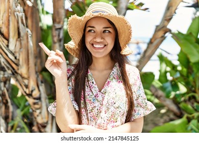 Young brunette woman outdoors on a sunny day of summer annoyed and frustrated shouting with anger, yelling crazy with anger and hand raised 
