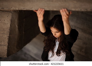 Young Brunette Woman Outside In Black Jacket Hands In Front . Horizontal  Not Looking In Camera