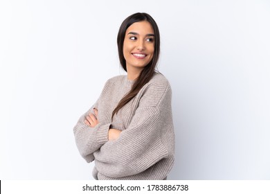 Young brunette woman over isolated white background with arms crossed and happy - Shutterstock ID 1783886738