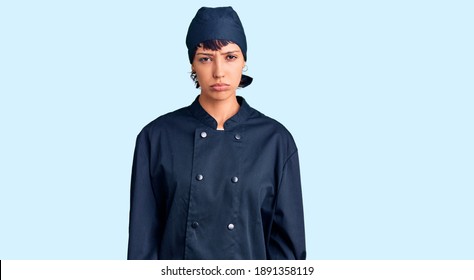 Young Brunette Woman With Short Hair Wearing Professional Cook Uniform Depressed And Worry For Distress, Crying Angry And Afraid. Sad Expression. 