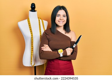 Young Brunette Woman Standing By Manikin Holding Scissors Smiling With A Happy And Cool Smile On Face. Showing Teeth. 