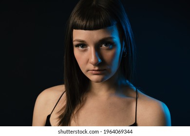 Young Brunette Woman Studio Intimate Portrait. Colored Gel Photography.