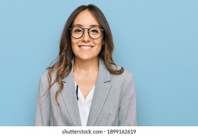 Young brunette woman wearing business clothes with a happy and cool smile on face. lucky person. 