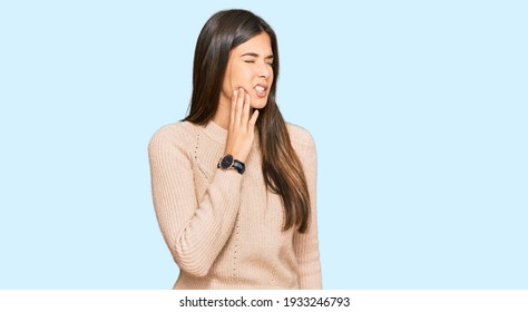 Young Brunette Woman Wearing Casual Winter Sweater Touching Mouth With Hand With Painful Expression Because Of Toothache Or Dental Illness On Teeth. Dentist 