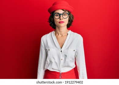 Young Brunette Woman Wearing Stewardess Style And Glasses With Serious Expression On Face. Simple And Natural Looking At The Camera. 