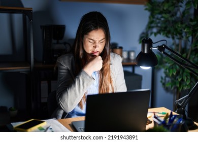 Young Brunette Woman Working At The Office At Night Feeling Unwell And Coughing As Symptom For Cold Or Bronchitis. Health Care Concept. 