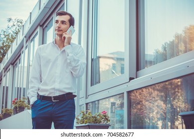 Young Buisnessman Talking On The Phone