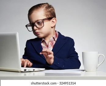 Young Business Boy. Funny Child In Glasses. Little Boss In Office