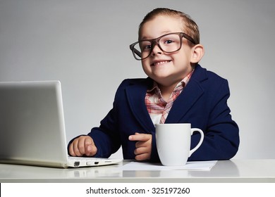 Young business boy. smiling child in glasses. little boss in office.funny kids