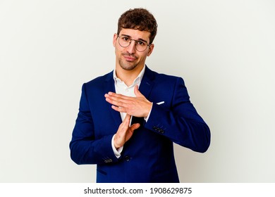 Young business caucasian man isolated on white background showing a timeout gesture.