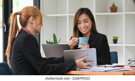 Young business colleagues are discussing corporate business plan together at office - Shutterstock ID 2168799213