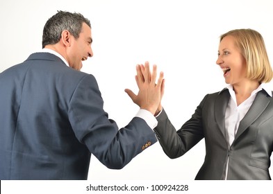 Young Business Colleagues Giving Each Other A High Five Isolated On White Background