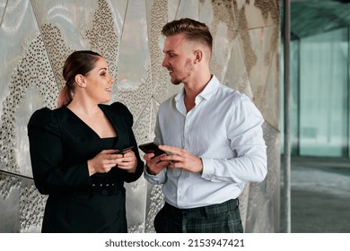 Young Business Colleagues Talking Outside The Office Building.