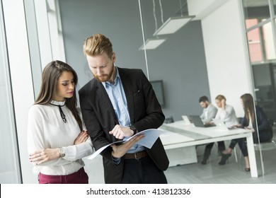 Young Business Couple Working In The Office