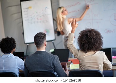 Young Business Female Rising Hand At The Meeting Asking Permission To Speak Or Ask A Question. Conference, Meeting, Business, Presentation 