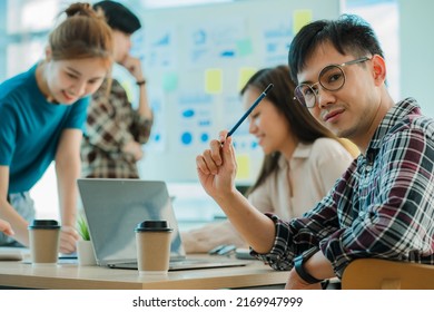 Young Business Finance Teams In Asia Work Together In Project Brainstorming Sessions. Plan A Strategy Small Start Up Company Or Office Collaboration Ideas