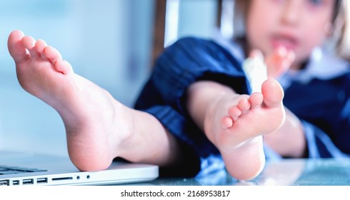 Young business girl with bare foots on the table in the office. Selective focus on foot. Horizontal image. - Shutterstock ID 2168953817