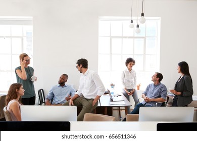 Young business group in discussion in their office - Shutterstock ID 656511346