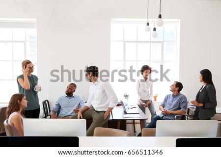 Young business group in discussion in their office