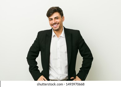 Young Business Hispanic Man Confident Keeping Hands On Hips.