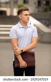 Young  Business Man In Classic Look Walking On The Street With Briefcase Designer Leather Laptop Satchel Portfolio Messenger Bag.  Different Color Of Bag And No Logo.