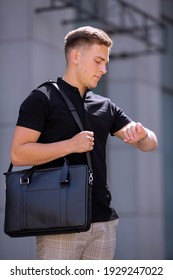 Young  Business Man In Classic Look Walking On The Street With Briefcase Designer Leather Laptop Satchel Portfolio Messenger Bag.  Different Color Of Bag And No Logo.