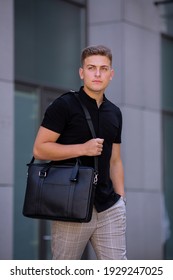 Young  Business Man In Classic Look Walking On The Street With Briefcase Designer Leather Laptop Satchel Portfolio Messenger Bag.  Different Color Of Bag And No Logo.